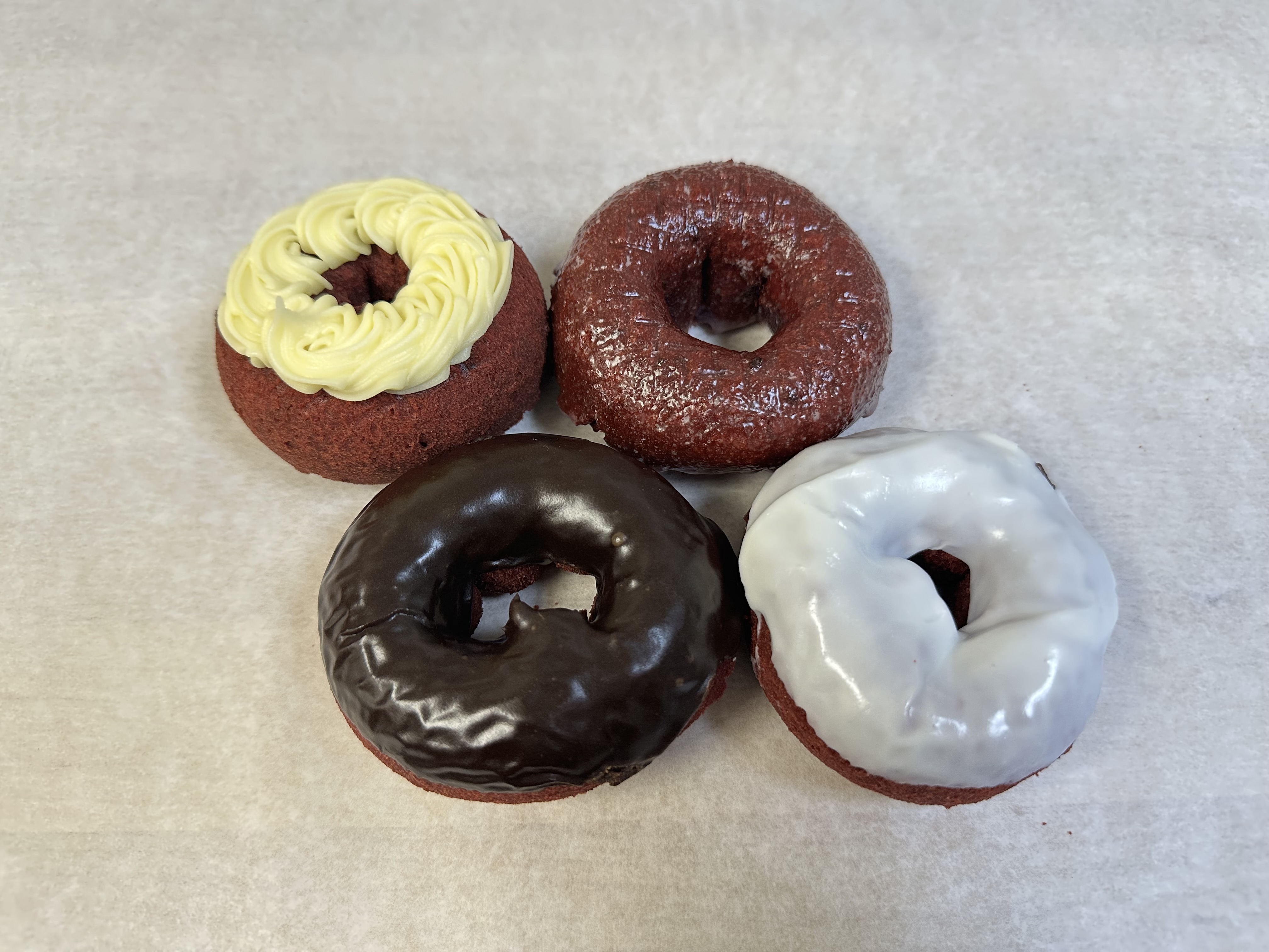 Red velvet donuts with cream cheese frosting